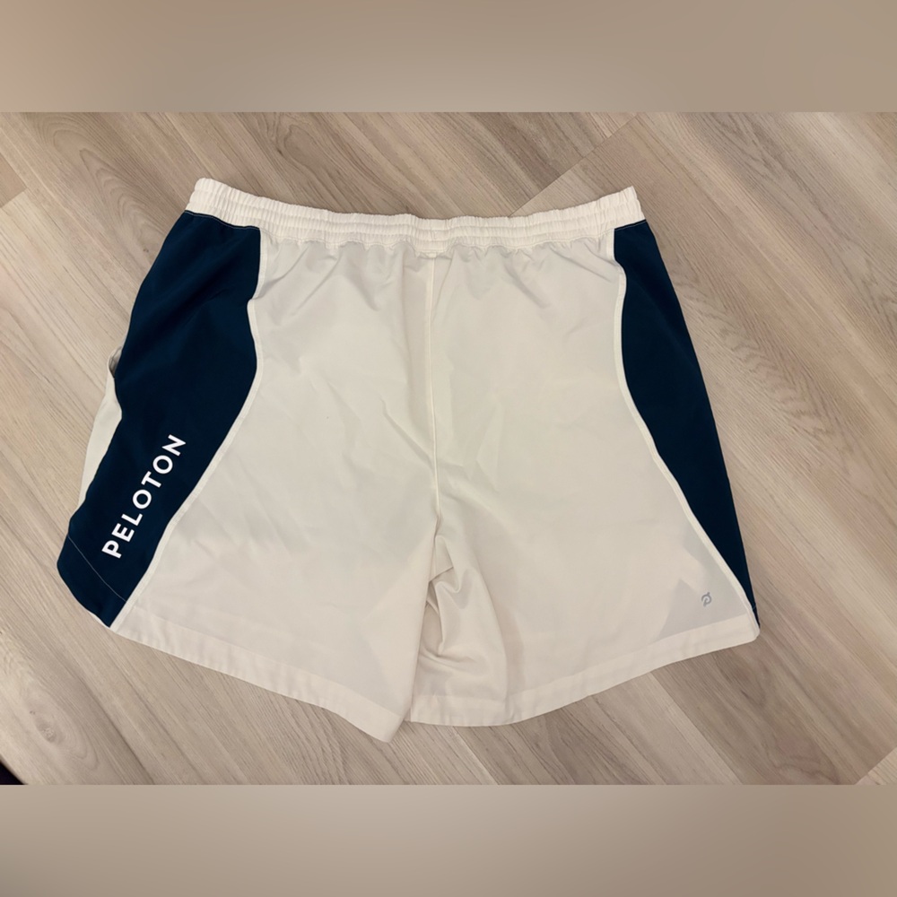 Peloton blue and white mens shorts 7”